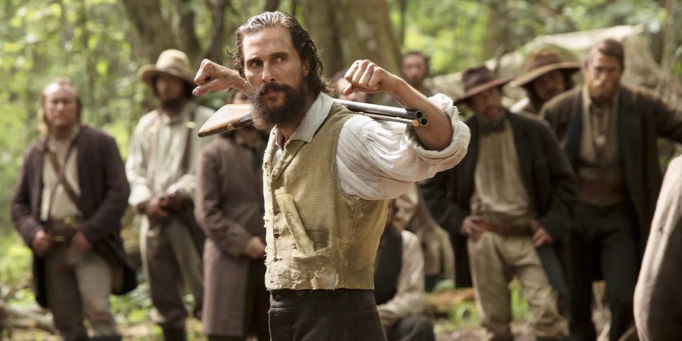 matthew-mcconaughey-in-the-free-state-of-jones-holding-a-gun-on-his-back.jpg