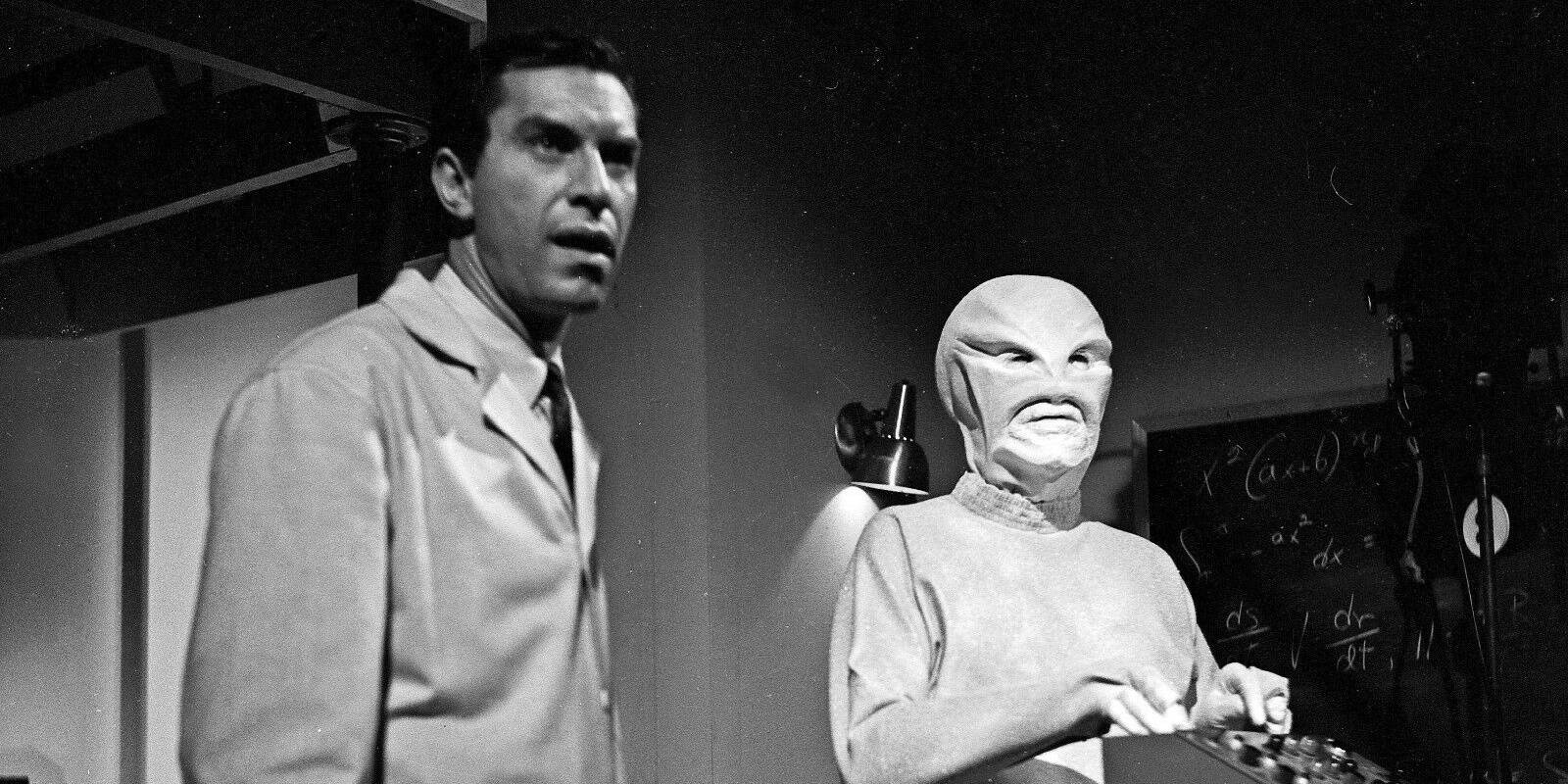 a-man-standing-with-an-alien-in-the-outer-limits.jpg