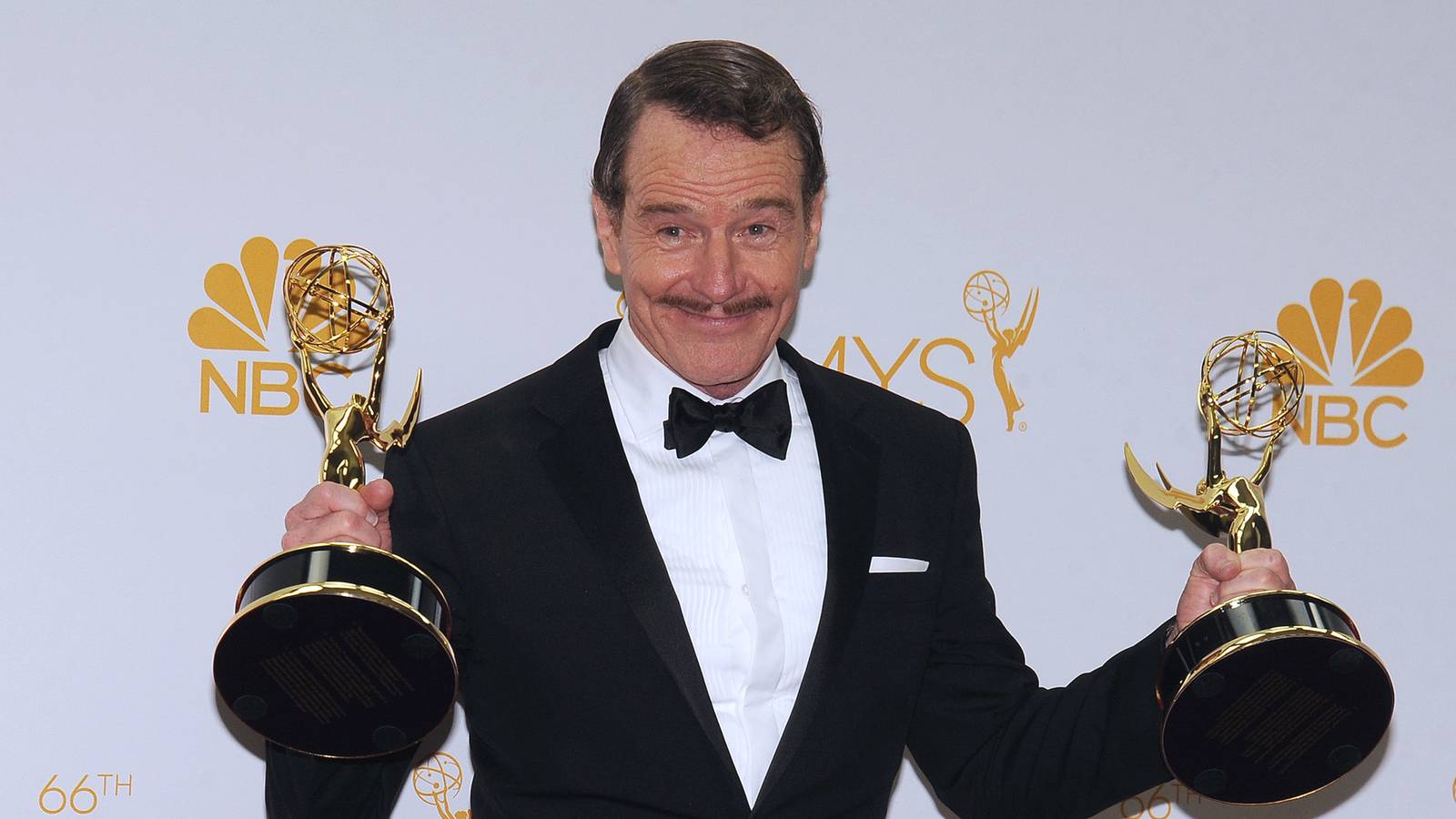 bryan-cranston-holding-two-emmy-awards-on-the-red-carpet.jpg