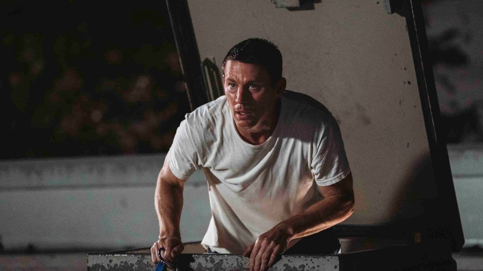 channing-tatum-emerging-from-a-roof-hatch-in-roofman.jpg