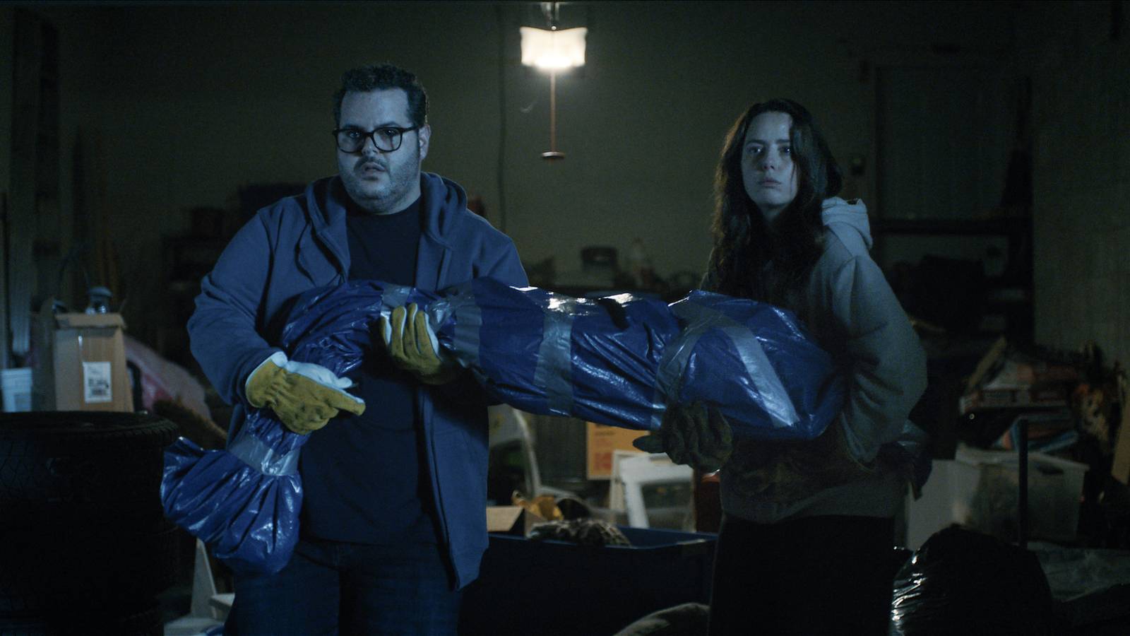 josh-gad-and-kaya-scodelario-hold-a-body-wrapped-in-tarp-in-adulthood.jpg