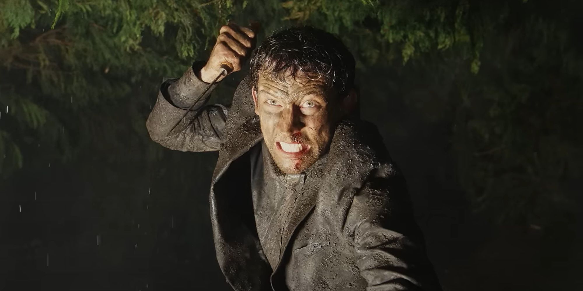 josh-oconnor-holds-up-a-knife-in-the-trailer-for-wake-up-dead-man.jpg