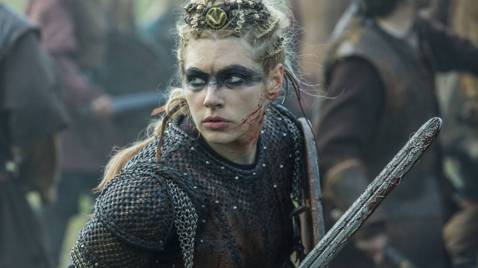 Top 20 Action-Packed TV Shows to Stream on Netflix Now katheryn-winnick-as-lagertha-in-full-chainmail-armor-wielding-a-sword-in-the-midst-of-battle-in-viki.jpeg