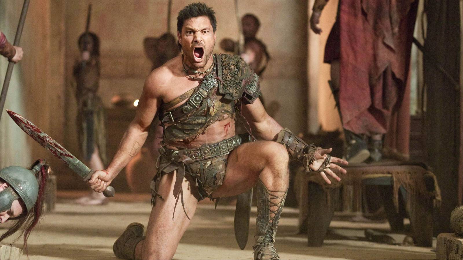 manu-bennett-as-crixus-taking-one-knee-bloody-sword-in-hand-and-screaming-in-spartacus.jpg