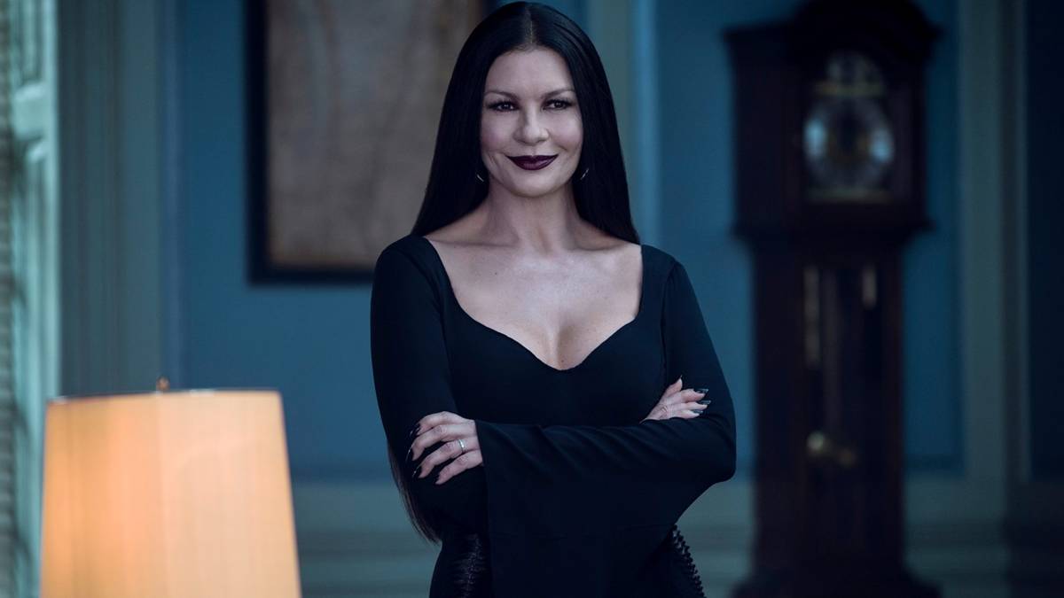 morticia_smiles_with_her_arms_crossed_in_wednesday-1.jpg