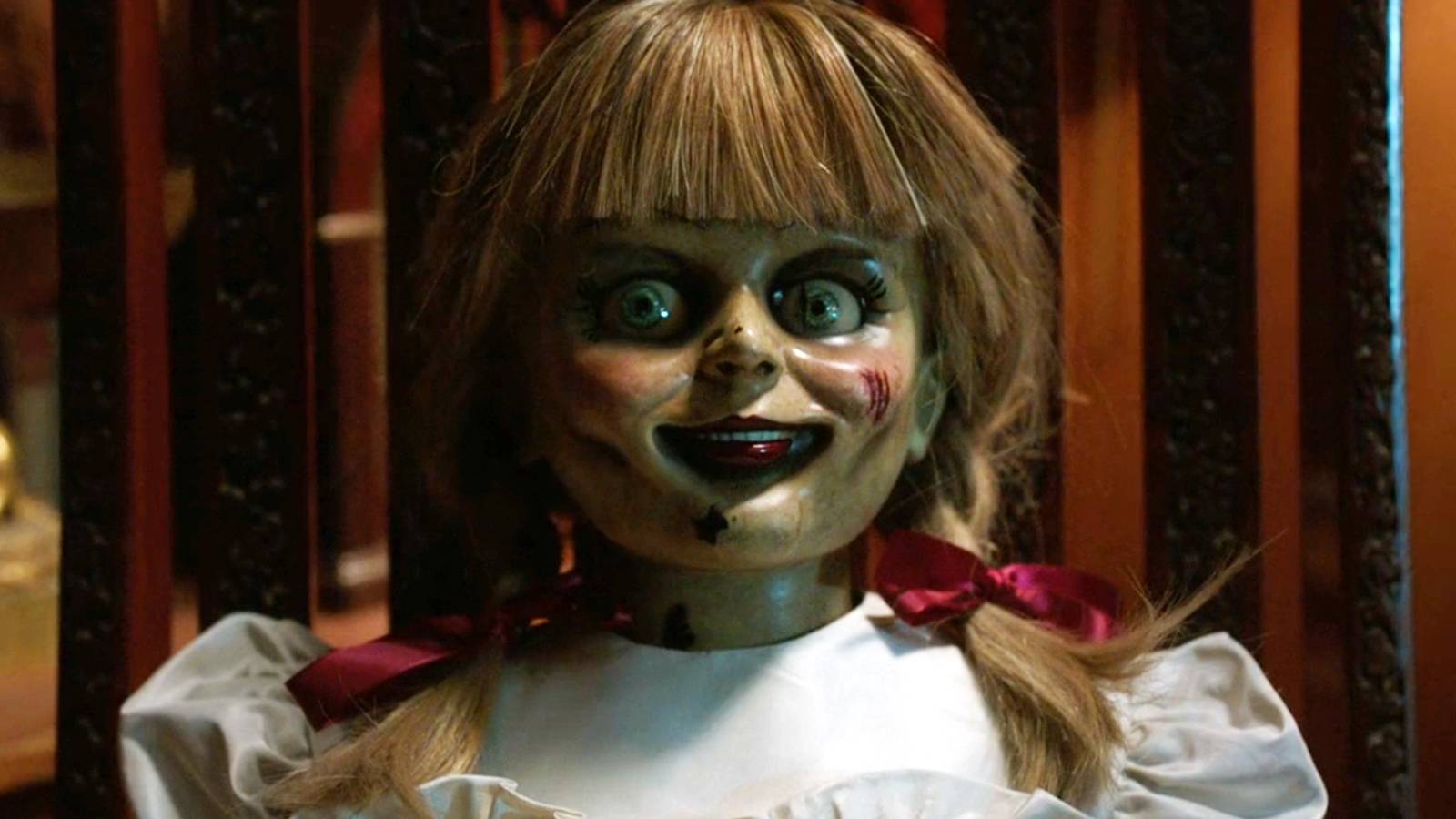 the-annabelle-doll-sitting-on-a-chair-in-annabelle-comes-homes.jpg