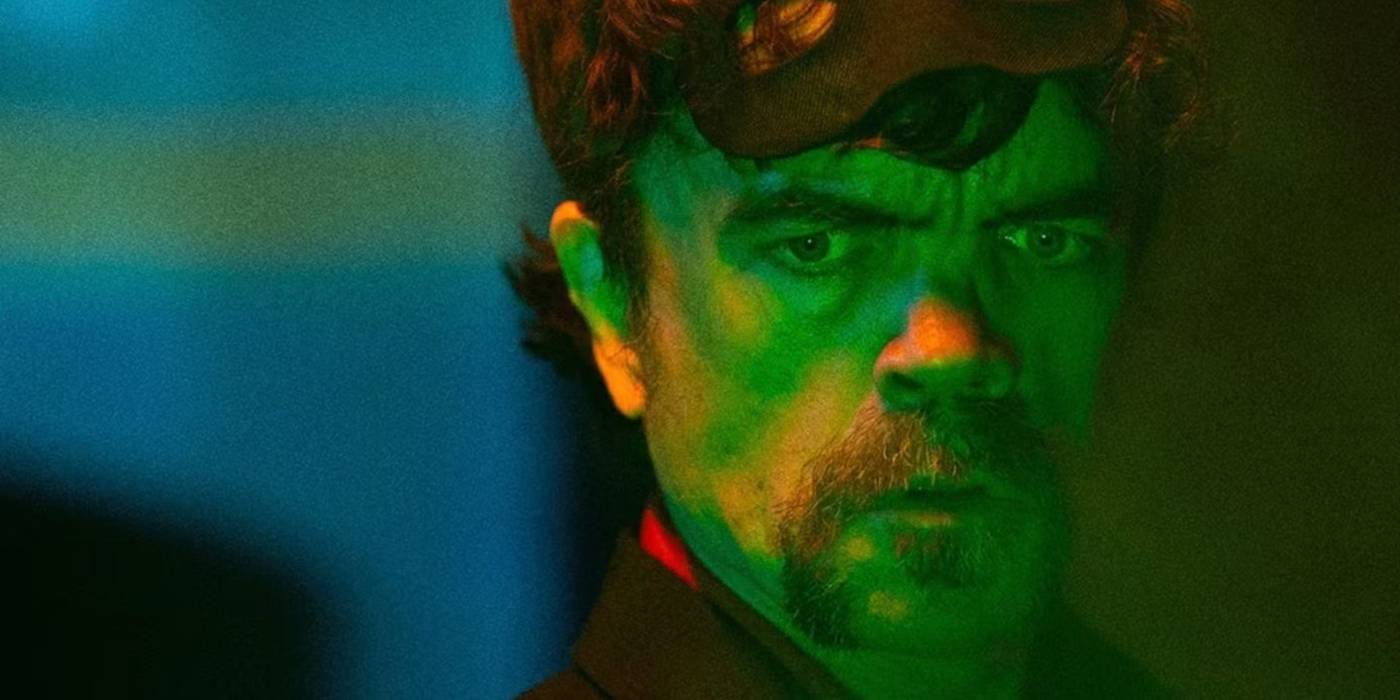 This Gory Superhero Story Starring Peter Dinklage Leans Into The Absurd In The Best Possible Way winston-gooze-looking-at-something-green-and-glowing-in-the-toxic-avenger.jpg