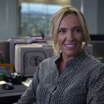 detective-grace-rasmussen-toni-collette-sitting-at-her-desk-and-smiling-in-unbelievable.jpg