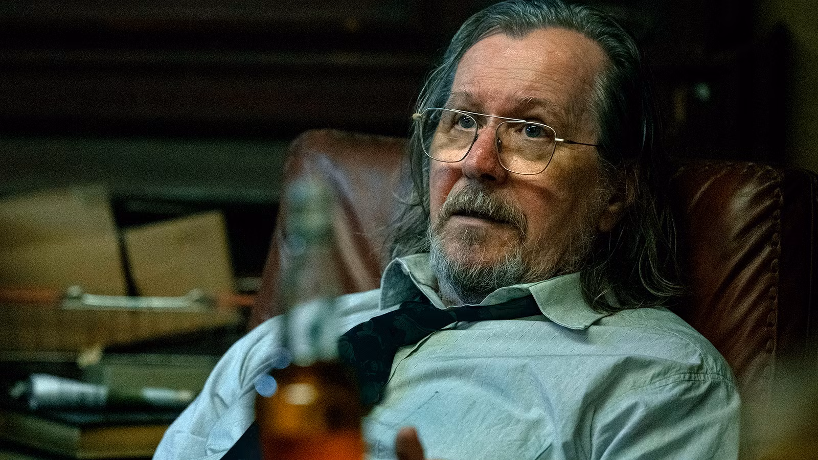 gary-oldman-s-jackson-lamb-looking-worried-while-sitting-in-a-chair-in-slow-horses-season-5.jpg