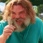 jack-black-as-steve-excitedly-holding-up-a-small-object-in-a-minecraft-movie.jpg