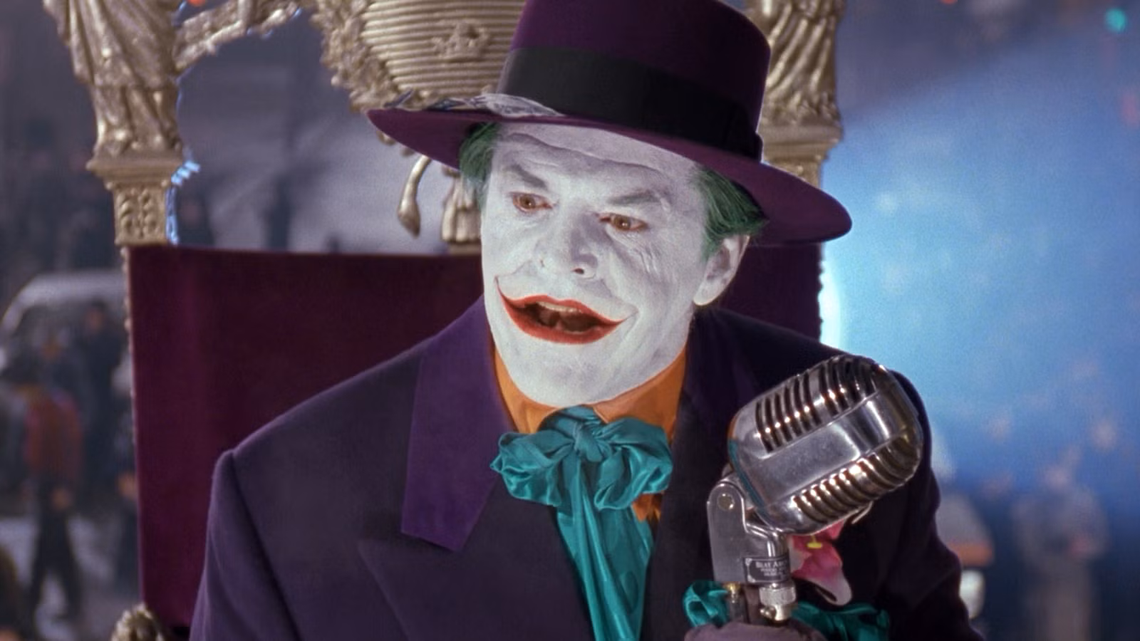 joker-looking-offscreen-while-holding-a-microphone-in-batman-1989.jpg