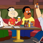 peter-cleveland-and-quagmire-smile-at-a-bar-table-as-joe-celebrates-in-family-guy-season-23-episode.avif